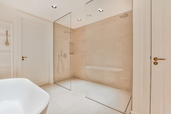 Professional grouting work during bathroom renovation process